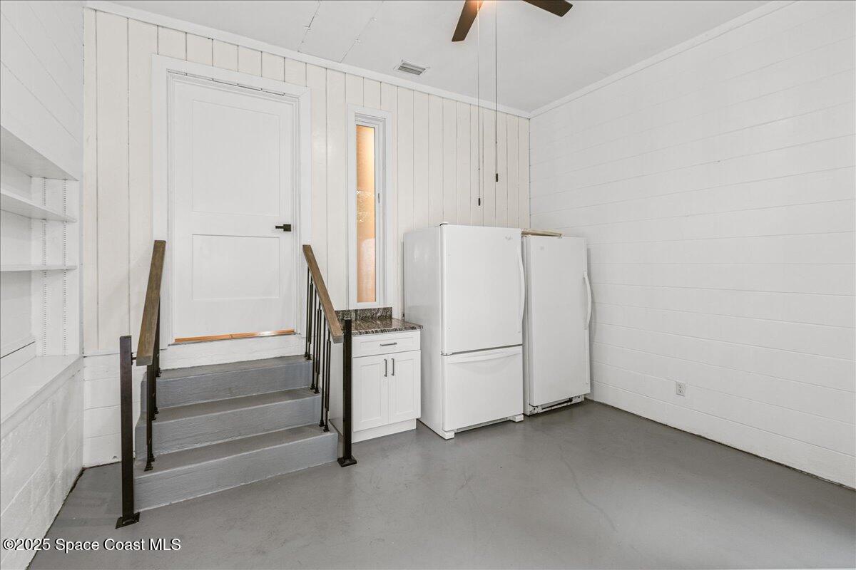 2302 Ruffner Road Melbourne, FL 32901 - Photo 42 of 80 a view of storage and utility room with refrigerator