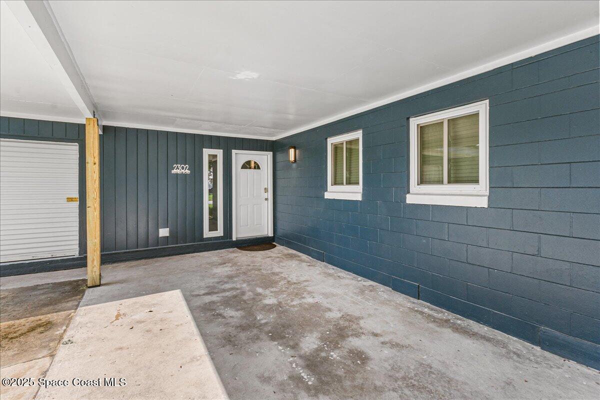 2302 Ruffner Road Melbourne, FL 32901 - Photo 46 of 80 a view of an empty room with a window