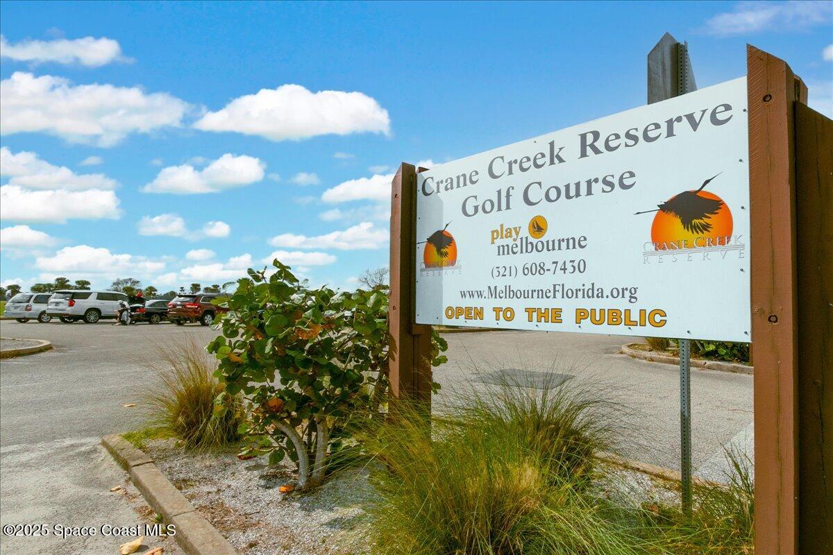 2302 Ruffner Road Melbourne, FL 32901 - Photo 48 of 80 a sign on the wall next to a road