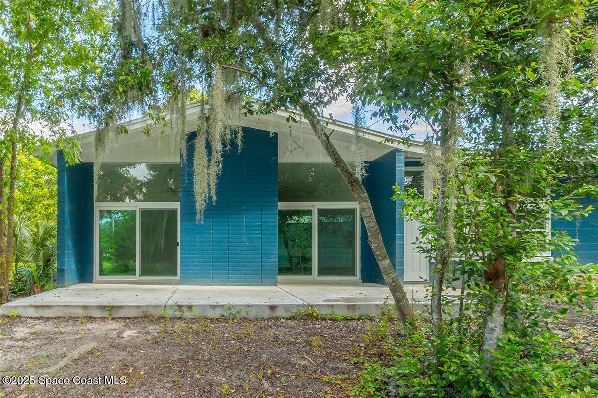 2302 Ruffner Road Melbourne, FL 32901 - Photo 5 of 80 front view of a house with a tree