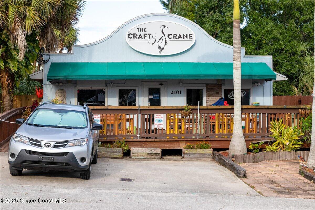 2302 Ruffner Road Melbourne, FL 32901 - Photo 62 of 80 a view of a car park with a car parked in front of it
