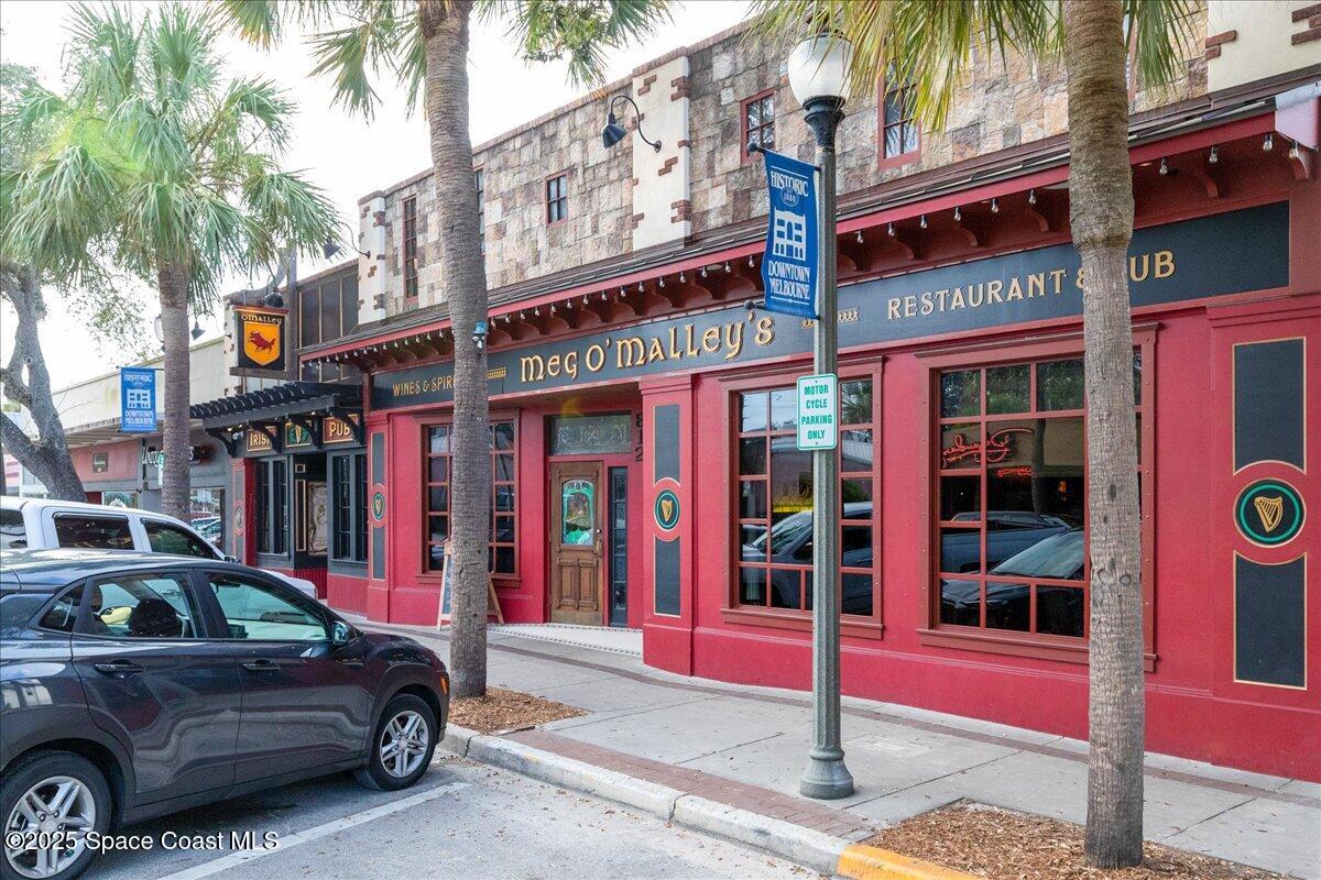 2302 Ruffner Road Melbourne, FL 32901 - Photo 66 of 80 a car parked in front of a building