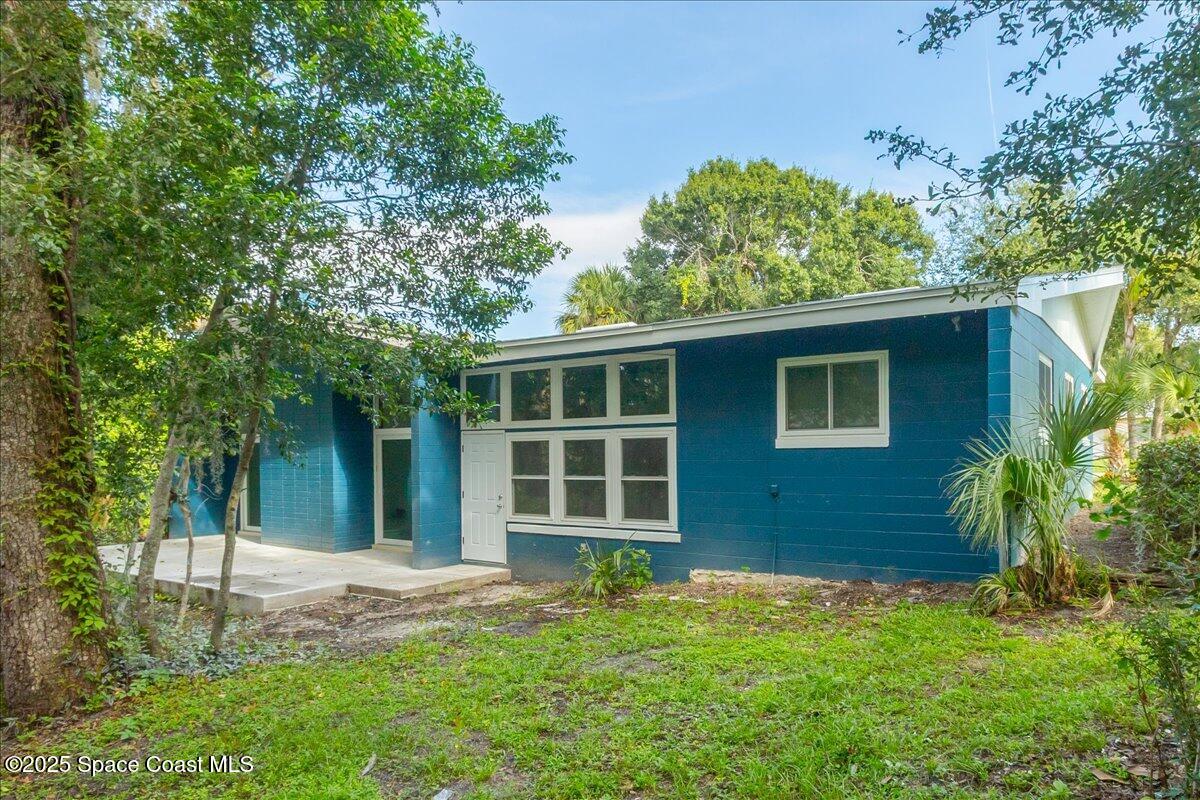 2302 Ruffner Road Melbourne, FL 32901 - Photo 7 of 80 front view of a house with a yard