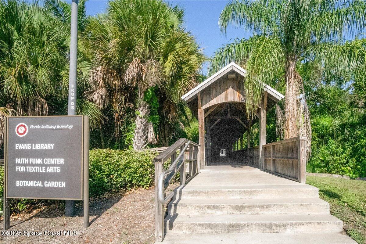 2302 Ruffner Road Melbourne, FL 32901 - Photo 74 of 80 a front view of a house with a garden and trees