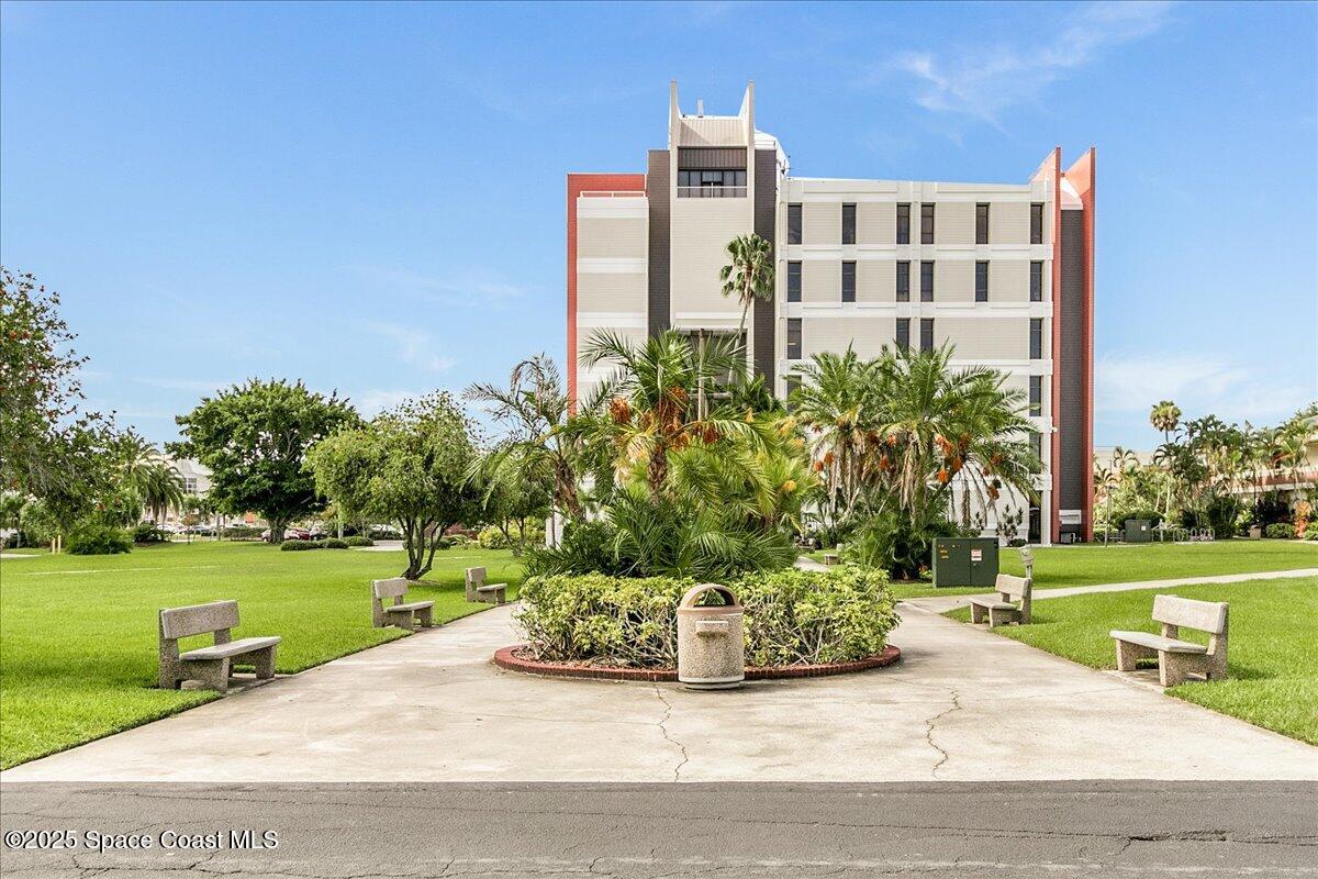 2302 Ruffner Road Melbourne, FL 32901 - Photo 77 of 80 a view of a building with garden and bench