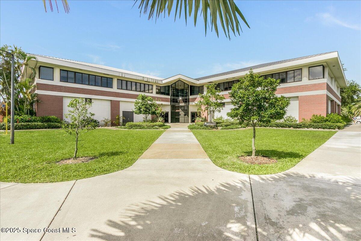 2302 Ruffner Road Melbourne, FL 32901 - Photo 78 of 80 a front view of a house with a yard
