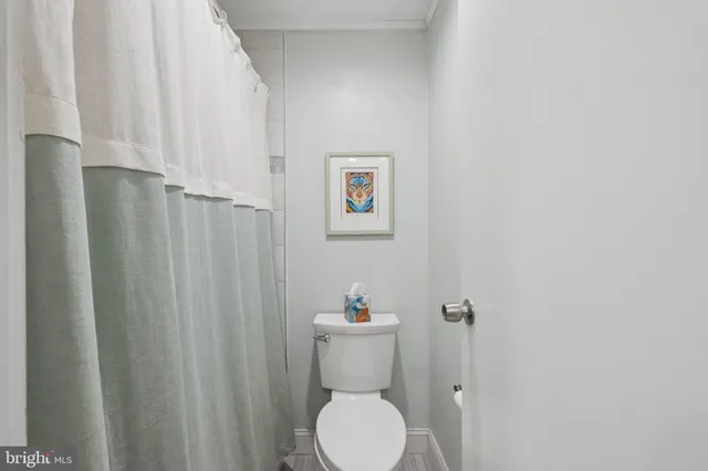 a bathroom with a toilet and a sink