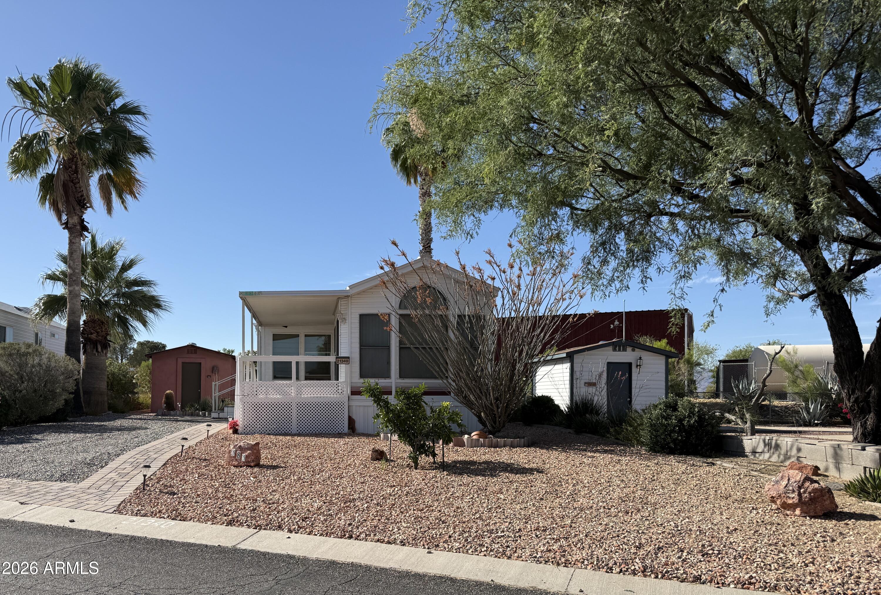 21340 Trading Post Trail Congress, AZ 85332 - Photo 31 of 31 a front view of a house with garden and plants