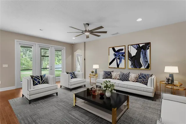 a kitchen with a sink a counter top space stainless steel appliances and wooden floor