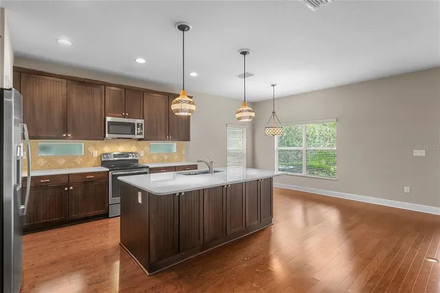 a view of a livingroom with a ceiling fan and window