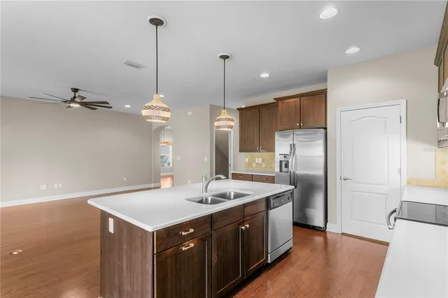 a bathroom with a granite countertop sink a large mirror and a