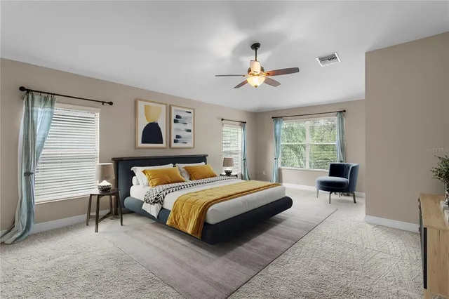 an empty room with closet and a ceiling fan