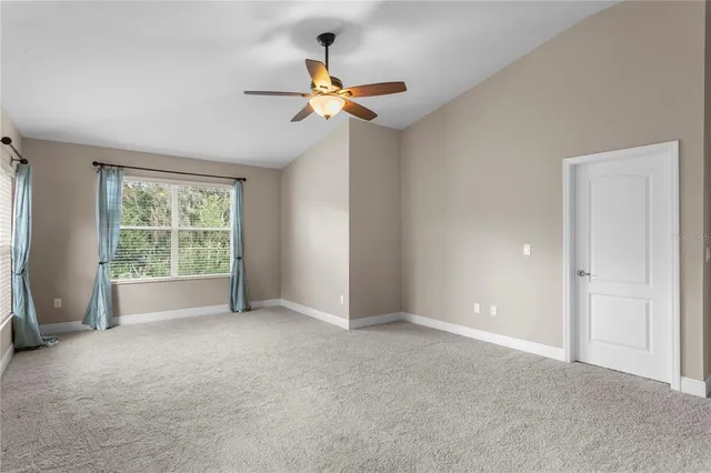 an aerial view of a house with a garden and swimming pool