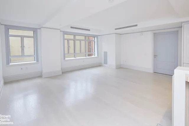 a dining hall with stainless steel appliances granite countertop a dining table and chairs