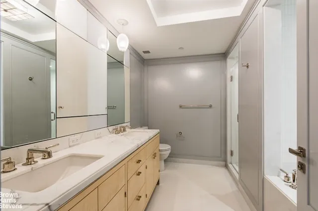 a bedroom with a bed and a chair