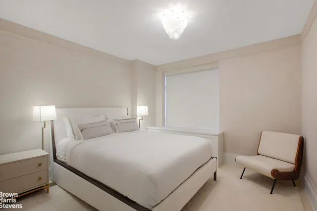 a bathroom with a double vanity sink mirror and shower