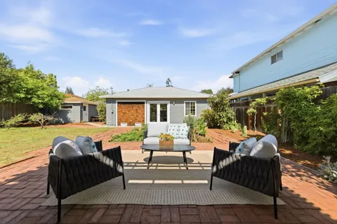 a outdoor living space with furniture and garden