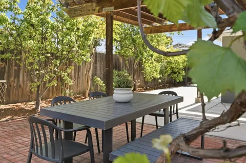 a view of a tables and chairs in the patio