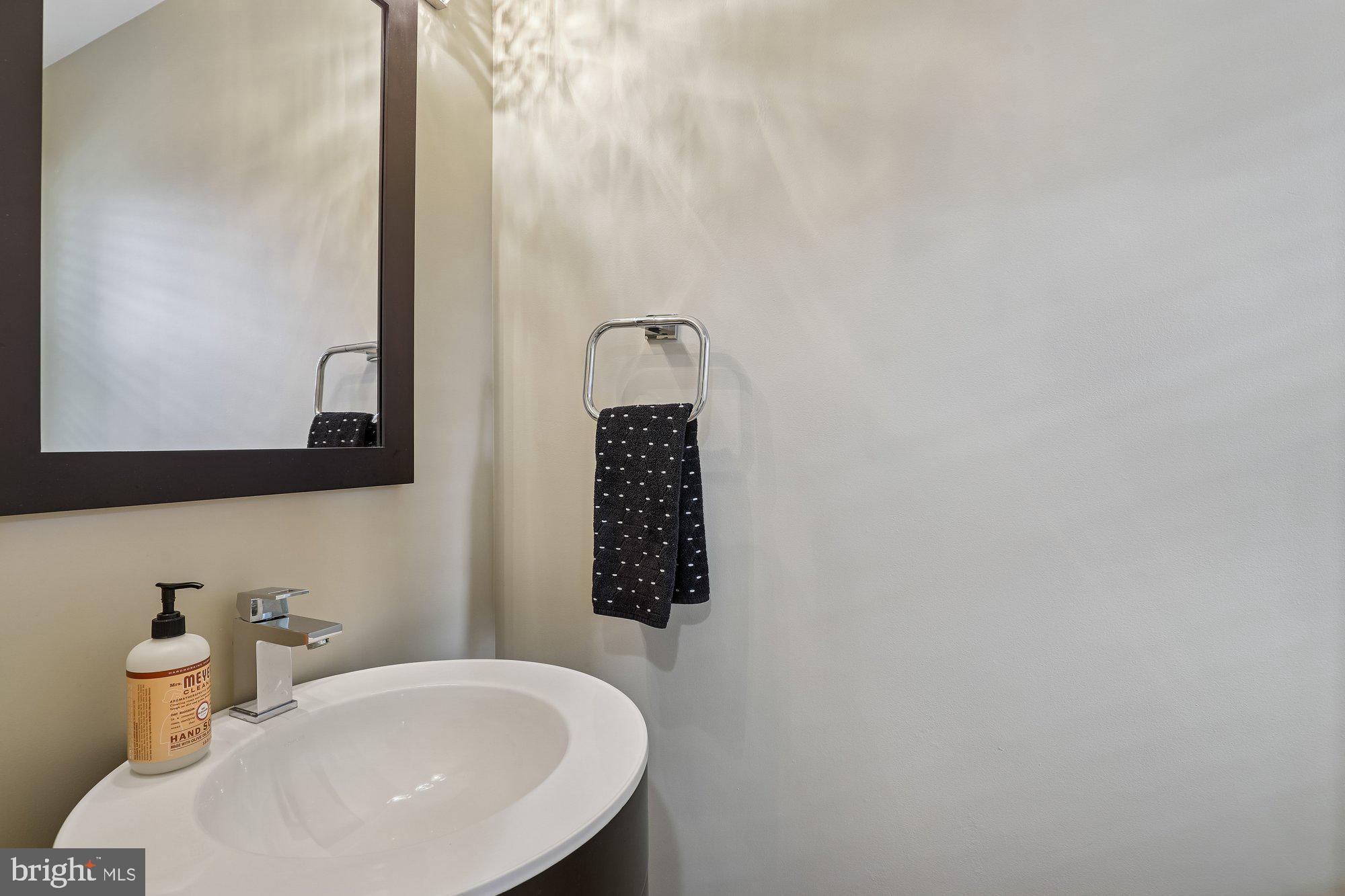8019 Galla Knoll Circle Springfield, VA 22153 - Photo 18 of 57 a bathroom with a sink and a mirror