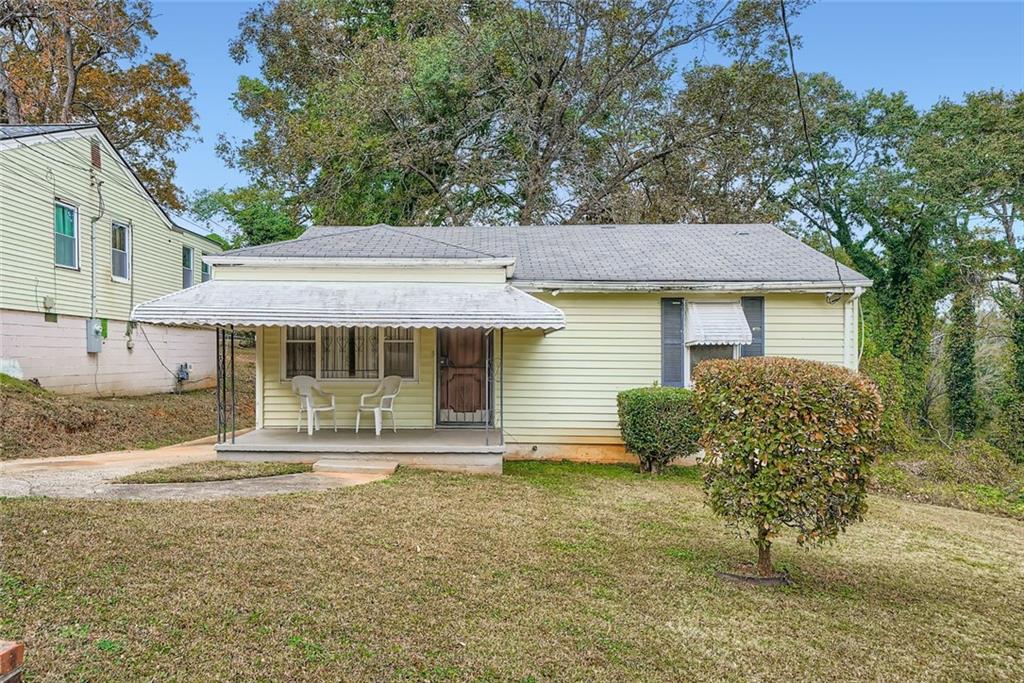 a front view of a house with garden