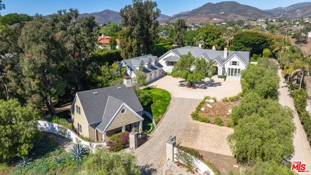 an aerial view of a house with a garden