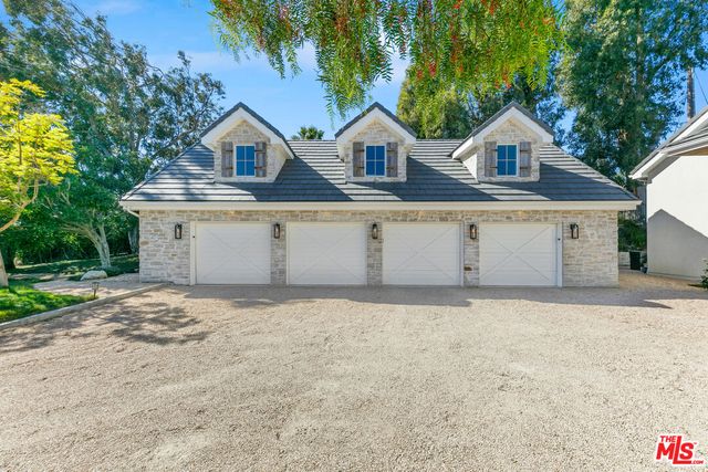 a bedroom with a bed potted plant with the window