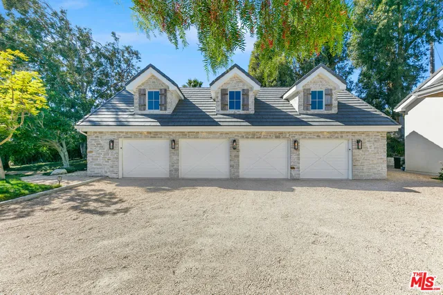 a bedroom with a bed potted plant with the window