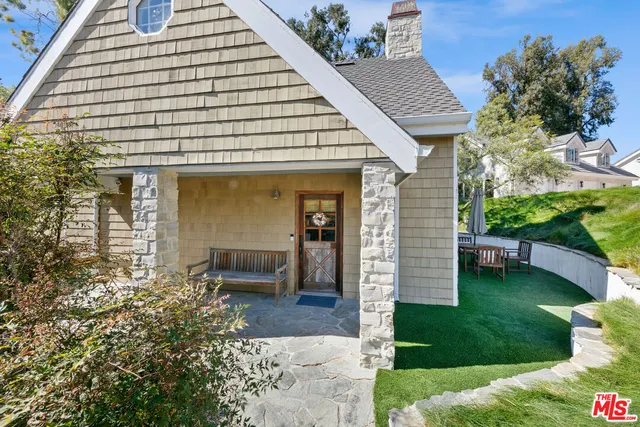 a kitchen with stainless steel appliances granite countertop a refrigerator a stove a sink and a microwave