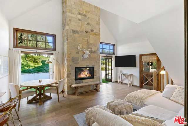 a view of a table and chairs under an umbrella