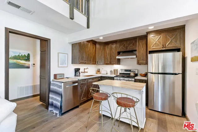 a bedroom with a bed and chair