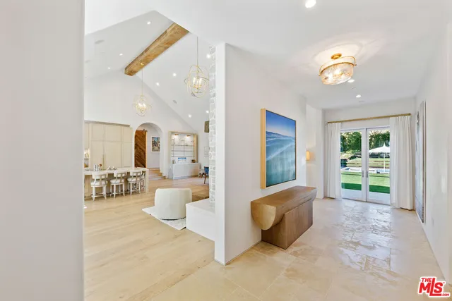 a view of living room with furniture and a window