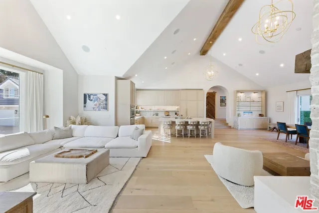 a living room with furniture and a table