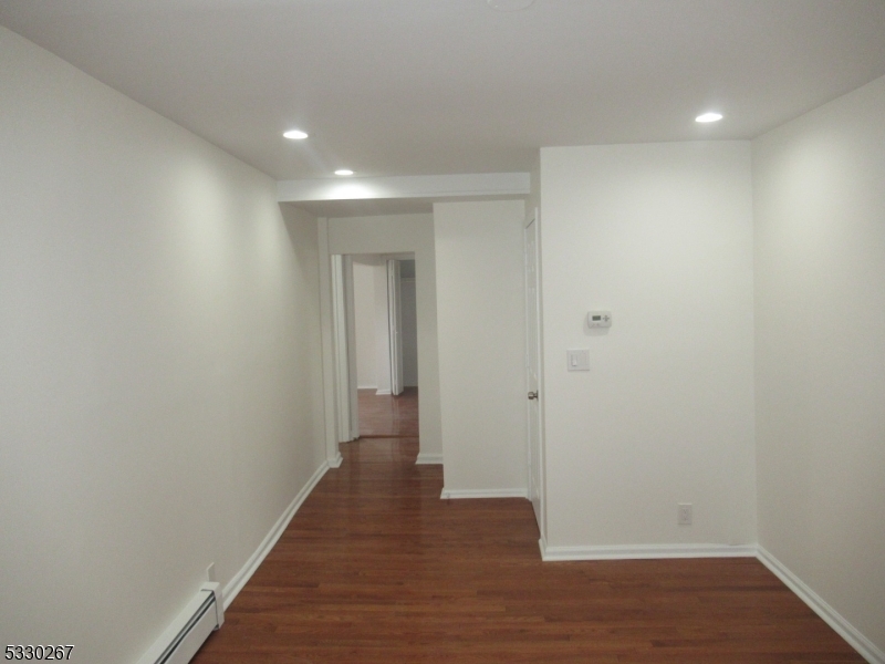10 Humbert Street Nutley, NJ 07110 - Photo 3 of 16 a view of a hallway with wooden floor