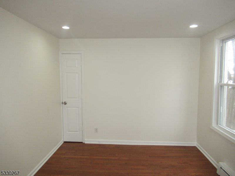 10 Humbert Street Nutley, NJ 07110 - Photo 8 of 16 a view of room with window and wooden floor