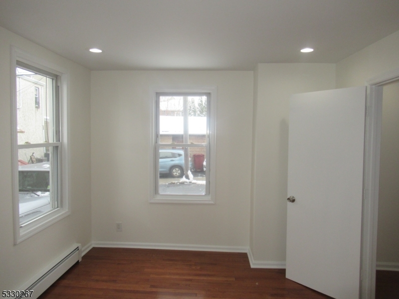 10 Humbert Street Nutley, NJ 07110 - Photo 9 of 16 a view of wooden floor and windows in a room