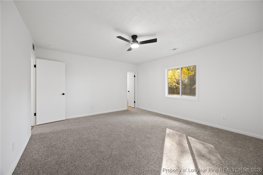 6541 Green Meadow Road Fayetteville, NC 28304 - Photo 18 of 35 a view of an empty room with a window