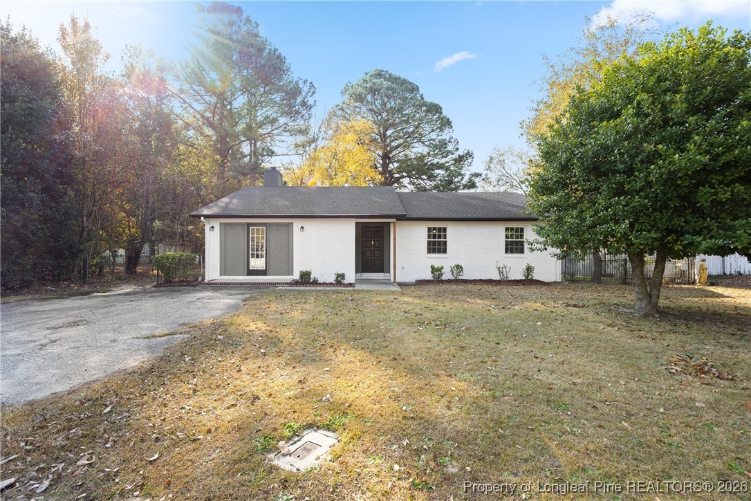 6541 Green Meadow Road Fayetteville, NC 28304 - Photo 2 of 35 a view of a house with a yard and large tree