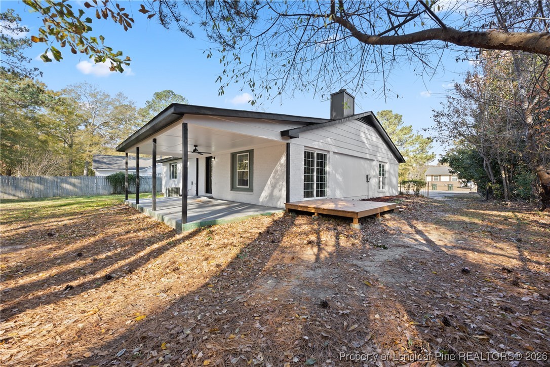 6541 Green Meadow Road Fayetteville, NC 28304 - Photo 30 of 35 a view of a house with a yard and wooden fence