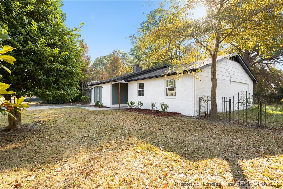 6541 Green Meadow Road Fayetteville, NC 28304 - Photo 3 of 35 a view of a house with a yard