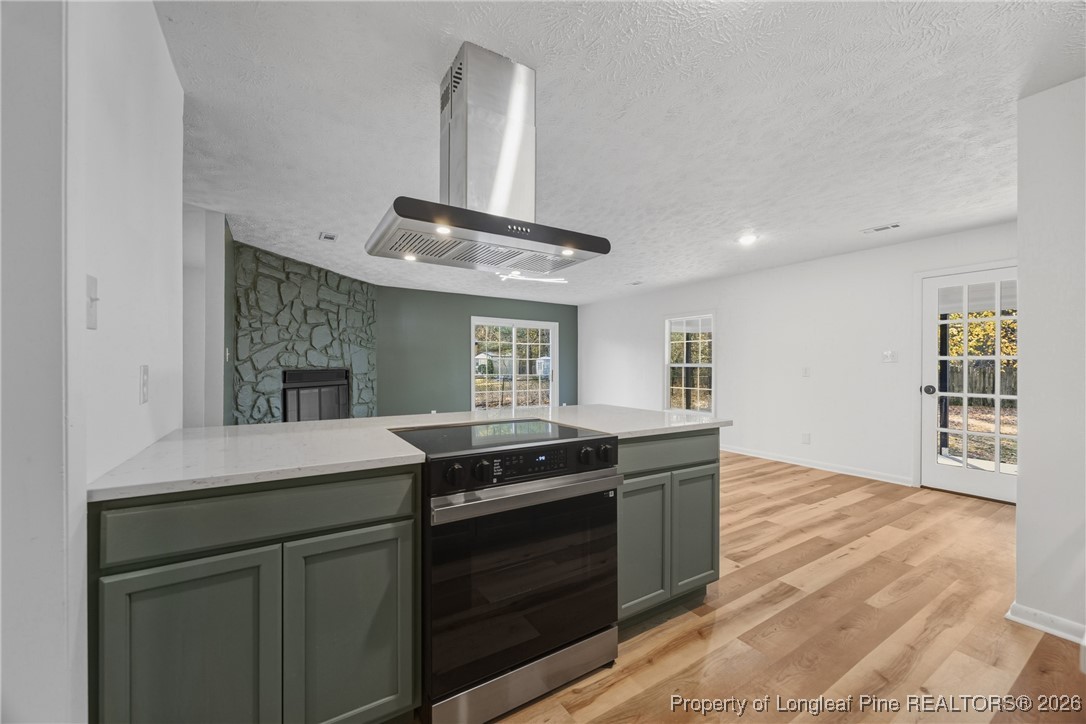 6541 Green Meadow Road Fayetteville, NC 28304 - Photo 5 of 35 a kitchen with granite countertop a stove and a sink