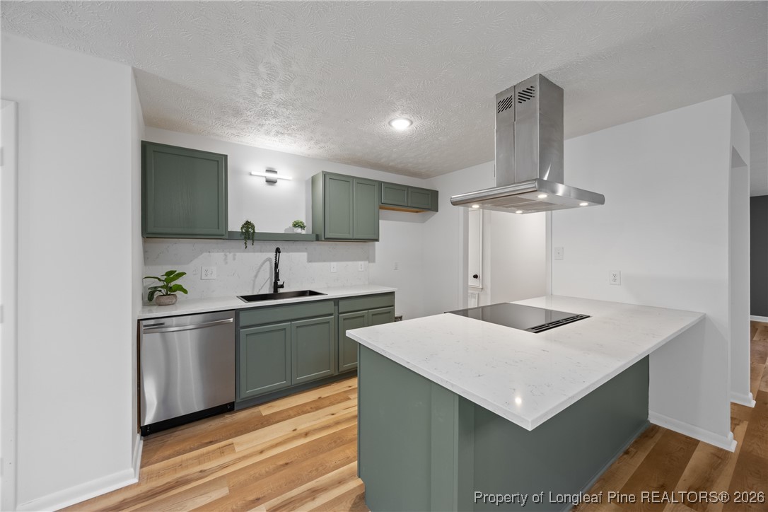 6541 Green Meadow Road Fayetteville, NC 28304 - Photo 7 of 35 a kitchen with stainless steel appliances a sink and stove