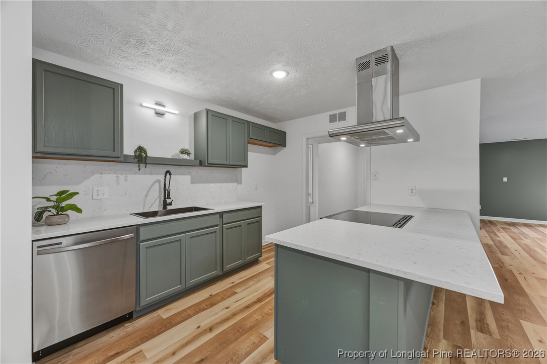6541 Green Meadow Road Fayetteville, NC 28304 - Photo 8 of 35 a kitchen with stainless steel appliances a sink and stove