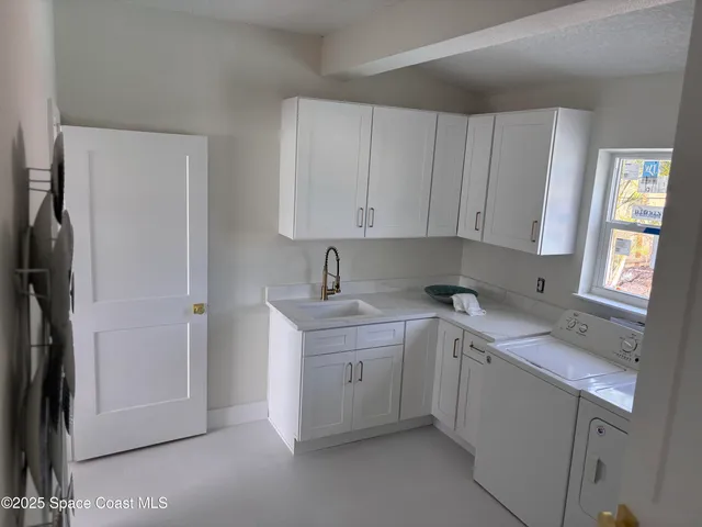 a bathroom with a toilet a sink a mirror a bathtub and shower