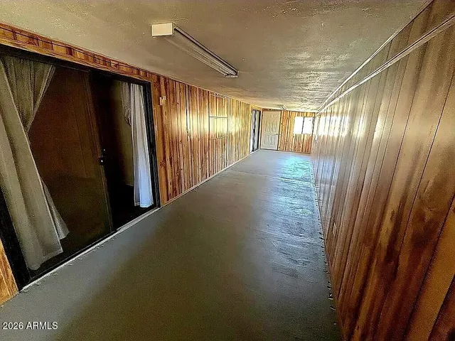 a view of gallery with wooden floor