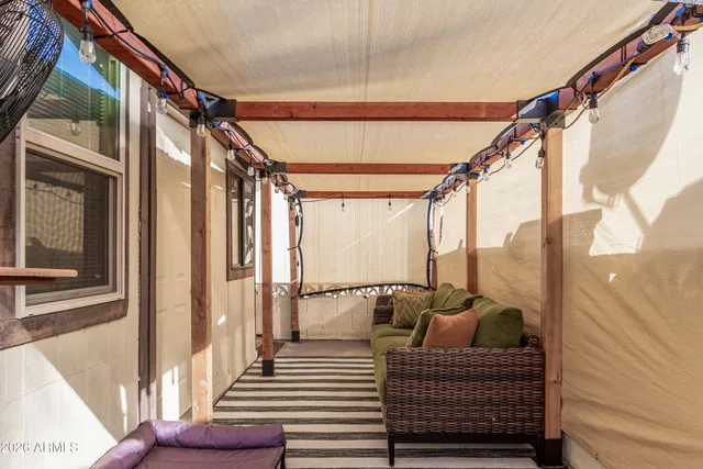 a view of balcony with furniture