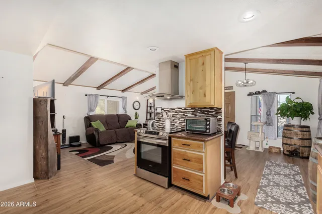 a view of a living room and hardwood floor
