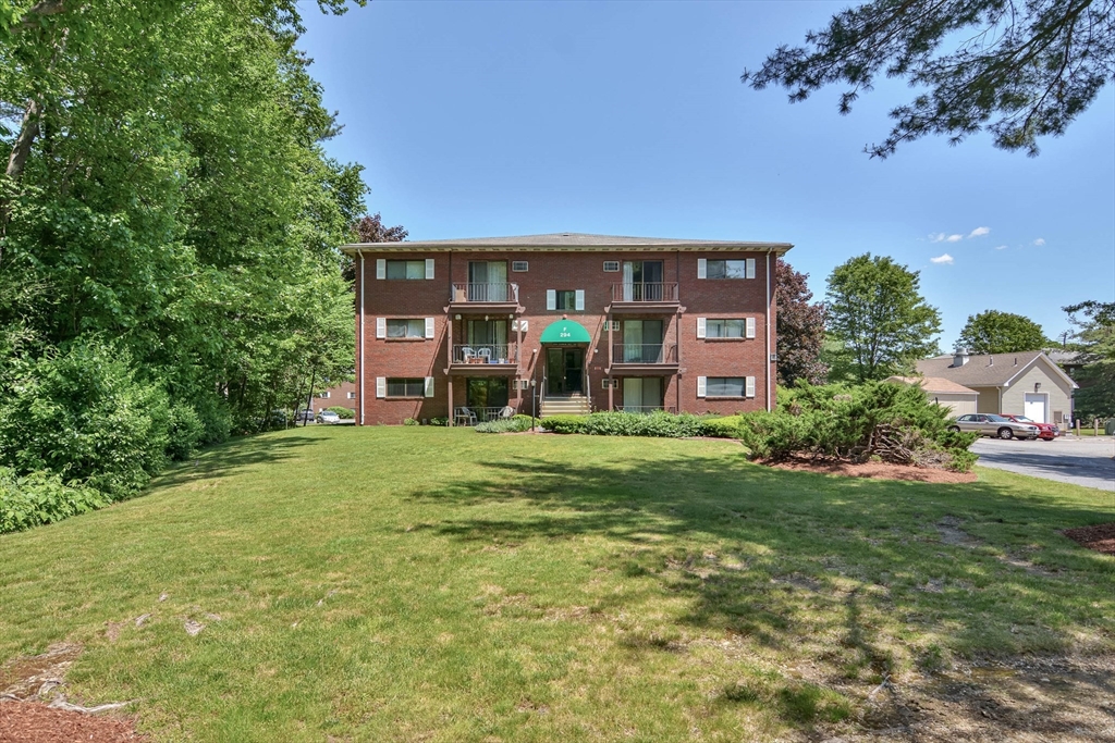 294 Codman Hill Road, Unit 33F Boxborough, MA 01719 - Photo 18 of 31 a front view of a house with garden
