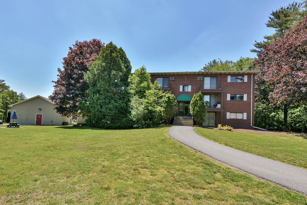 294 Codman Hill Road, Unit 33F Boxborough, MA 01719 - Photo 20 of 31 a house view with a garden space