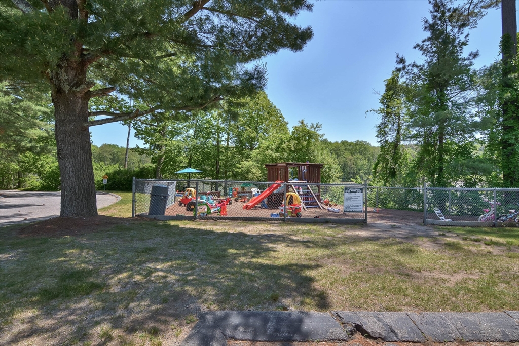 294 Codman Hill Road, Unit 33F Boxborough, MA 01719 - Photo 22 of 31 a view of outdoor space with trampoline