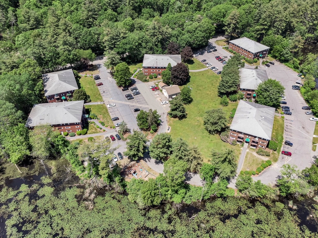 294 Codman Hill Road, Unit 33F Boxborough, MA 01719 - Photo 31 of 31 an aerial view of house with yard and outdoor seating